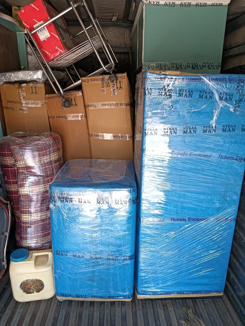 Packing household items into labelled cartons