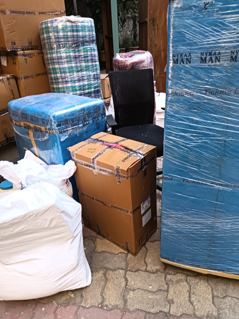 Office chairs and workstations packed and lined up